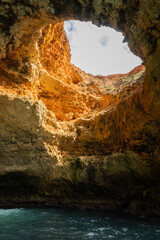 sandstone coastline in Portugal Algarve near Benagil. Caves and grotto rock formations make popular tour sightseeing from the sea on sunny good weather day