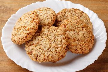 Homemade peanut butter cookies baked on wooden breakfast table