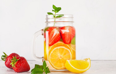 drink with strawberry lemon and mint on white
