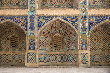 Front wall of medersa Nadir Divan-Begui, in the ancient city of Bukhara, Uzbekistan