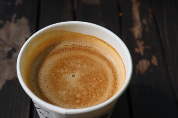 Hot coffee with milk in paper cup