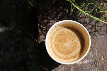 Hot coffee with milk in paper cup