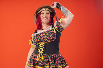 Woman wearing a dress and hat for a June party in fun poses