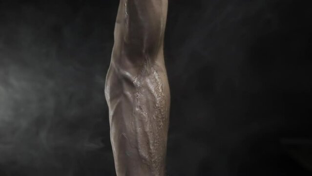 Illustration of a veiny muscular human arm with water splashes