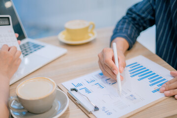 Close-up image of man and woman calculating business