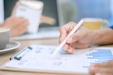 Fototapeta premium Close-up image of man and woman calculating business