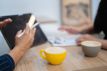 Close-up image of man and woman calculating business