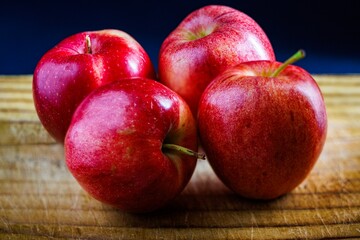Four apples on a Wooden table 