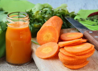 fresh organic carrots and carrot juice