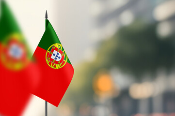 Small flags of Portugal on a blurred background
