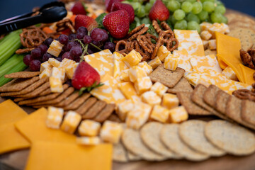 Graze Board. The board includes a variety of cheeses, fruits, vegetables, dips and crackers.