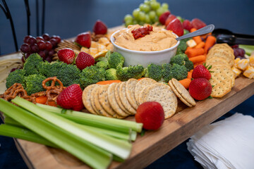 Graze Board. The board includes a variety of cheeses, fruits, vegetables, dips and crackers.