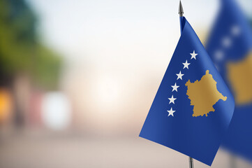 Small flags of Kosovo on a blurred background