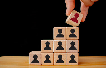 Hand holds wood cubes with person data, Customer psychology profile or characteristics.Human...
