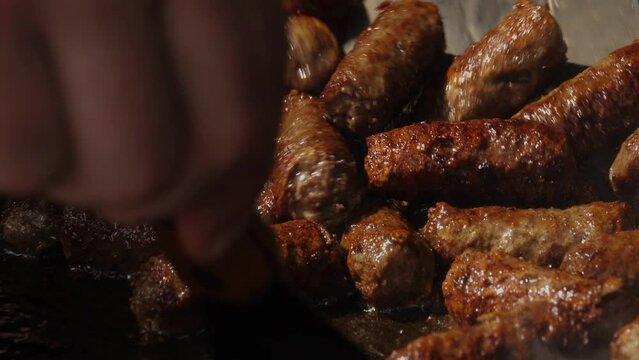 Grilled Balkan Cevapi on Hot Grill Pan in Slow Motion