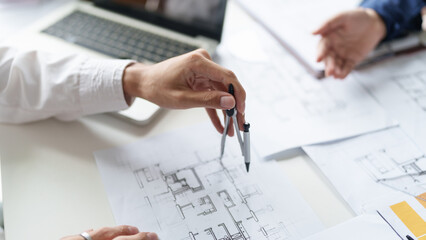 Architecture drawing on architectural project business architecture building construction Colleagues designer Planning Design on blueprint and compasses