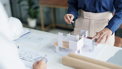 House model on Buleprint construction drawing and drawing equipment stationary Architect analyzing...