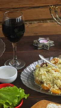 Matzo and menorah on the holiday table with traditional Passover Seder snacks