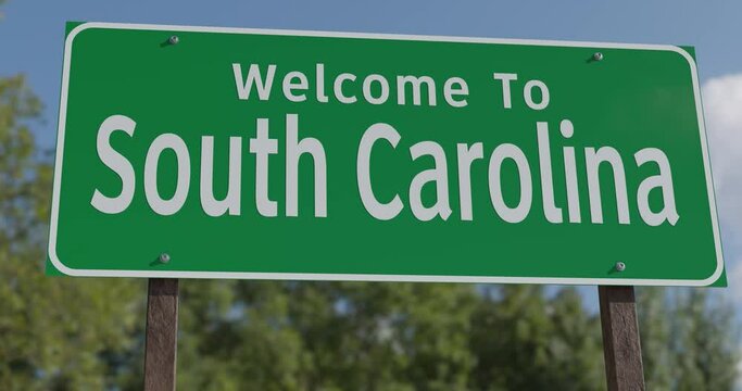 Driving By A Welcome To South Carolina Green Road Sign Against a Blue Sky and Clouds.

