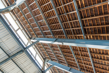 Fototapeta premium Wood and steel roof frame structures for building construction