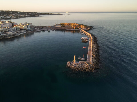 The harbor of the famous resort Chersonissos on Crete, Greece during sunset.