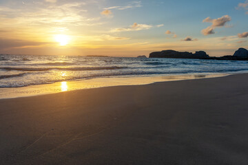 Summer background with tropical beach during sunset. Holiday vacation and travel concept.