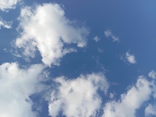 bright blue sky with clouds on a clear day