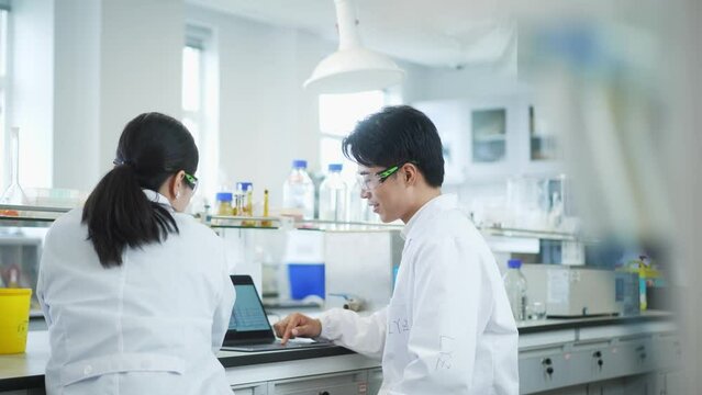 doctor coworking with tablet in lab