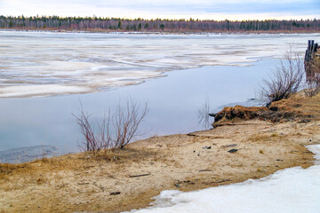 Spring flood, river with remnants of ice, melting ice, landscape river ice spring, thawed dangerous...