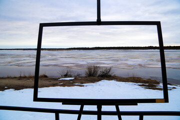 Spring flood, river with remnants of ice, melting ice, landscape river ice spring, thawed dangerous...