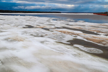 Spring flood, river with remnants of ice, melting ice, landscape river ice spring, thawed dangerous...