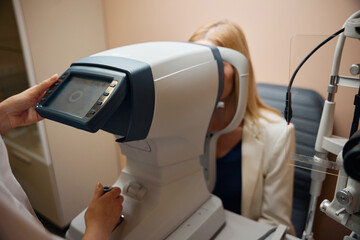 Naklejka premium Young woman at an appointment with an ophthalmologist