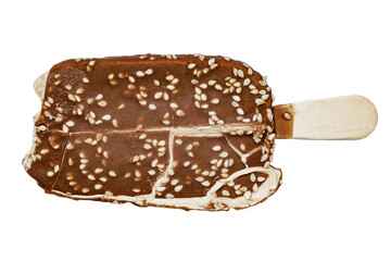 Ice cream on a stick with chocolate glaze and sesame seeds close-up isolated on a white background.
