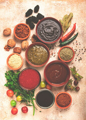 assortment of Georgian sauces and spices, top view, set of spices and tkemali, Georgian, food background,