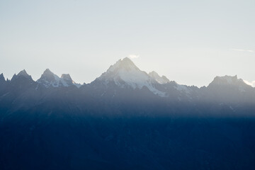 In the background, there is a blue sky over a snowy mountain, Zanskar, Himalayas