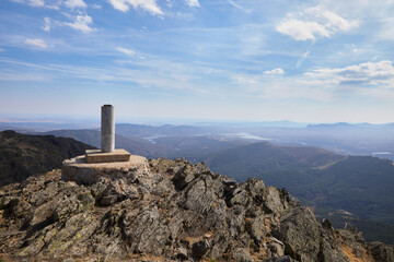 Cement triangulation station on top of a very high mountain over the plateau in Madrid, Spain