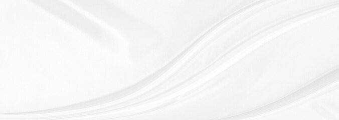 White gray satin texture that is white silver fabric silk panorama background with beautiful soft blur pattern natural.