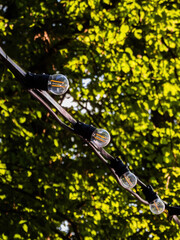 Obraz premium retro lamps on a street cable outdoor