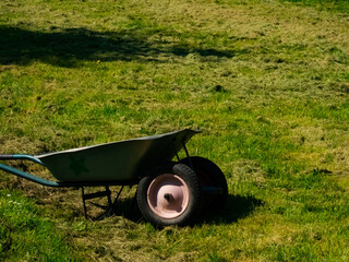 Trolley wheelbarrow on grass lawn