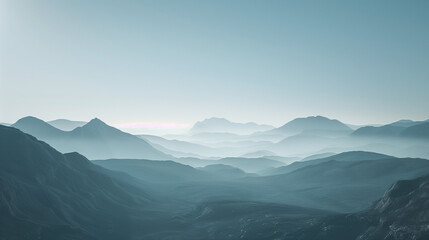 Obraz premium Misty mountain landscape with layered peaks creating a dreamy and tranquil atmosphere. Ideal for nature, travel, and adventure projects.