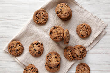 Homemade Gooey Chocolate Chip Cookies on a white wooden background, top view. Overhead, flat lay.
