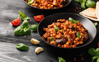 Eggplant and Chickpea Stew in tomato sauce, garlic, spices and pita bread. Healthy food