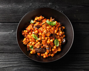Eggplant and Chickpea Stew in tomato sauce, garlic, spices and pita bread. Healthy food