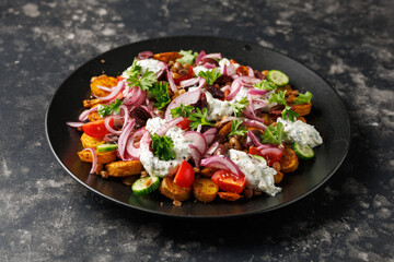Warm greek potatoes salad with green lentils, tzatziki, tomatoes, cucumbers and kalamata olives.