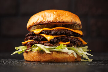 Smash burger with lettuce, cheddar cheese and sauce