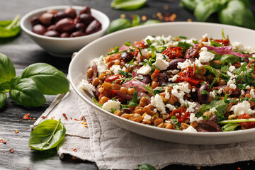 Lentil and Goats Cheese Salad with olives, onion, sun dried tomatoes and arugula. Healthy food