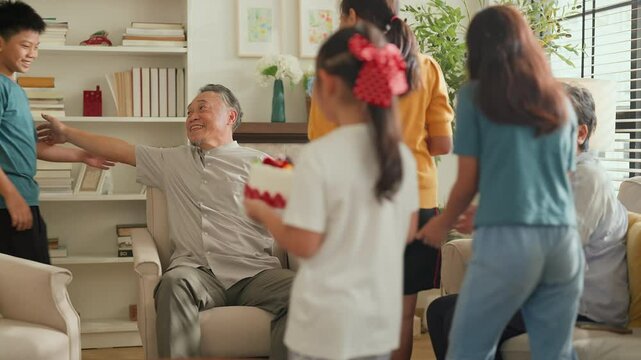 happiness memory day grand children birhday cake surprise grandparent they visit with special prize and wonderful cake surprize party make great smile on grandfather face love and relation happy home