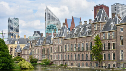 Fototapeta premium The Binnenhof in The Hague, Netherlands with Modern Towers in Background