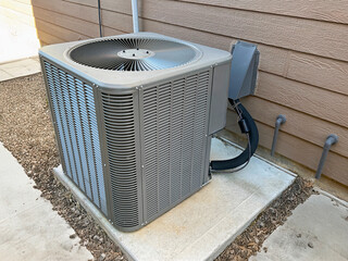 HVAC air conditioning exterior condensing unit of a house.