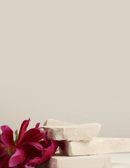 Stones platform podium and flower on beige background. Minimal empty display product presentation...